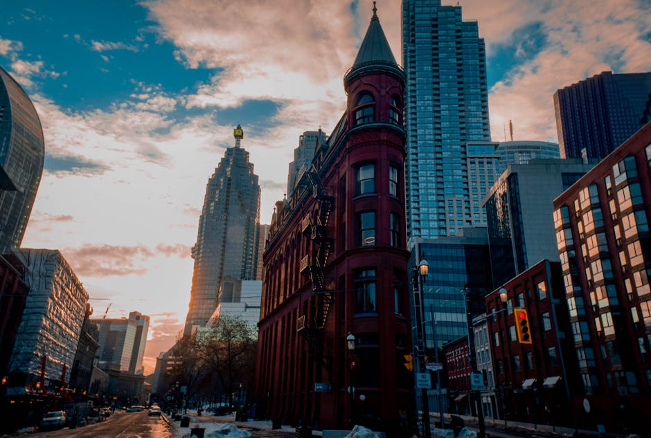 Beautiful winter sunset with Toronto's historic Flatiron Building surrounded by skyscrapers