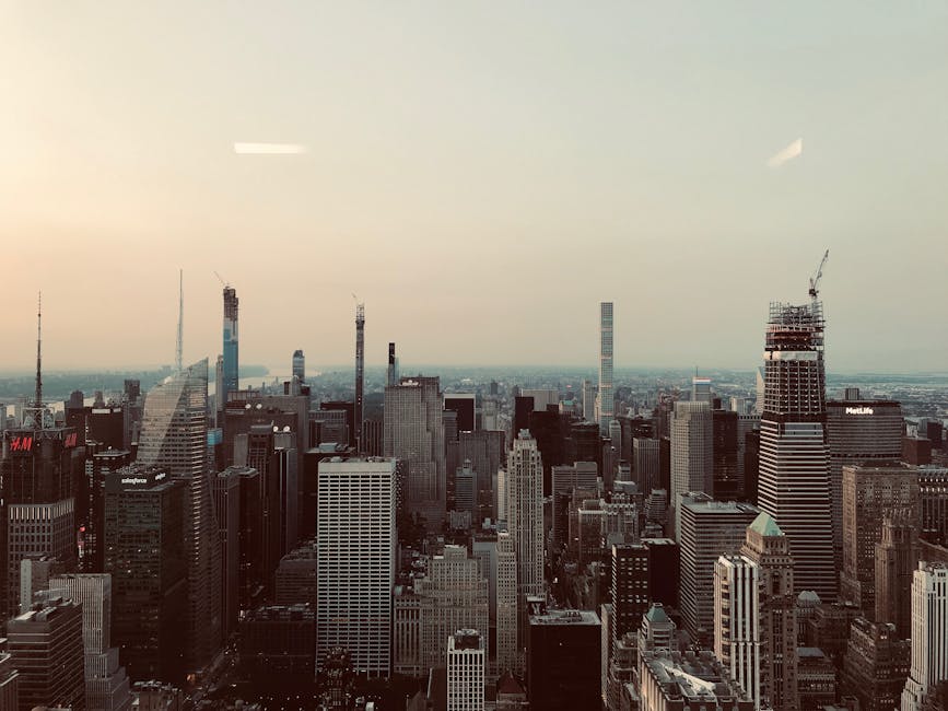 A breathtaking aerial shot of New York City's iconic skyline featuring skyscrapers under a clear sky