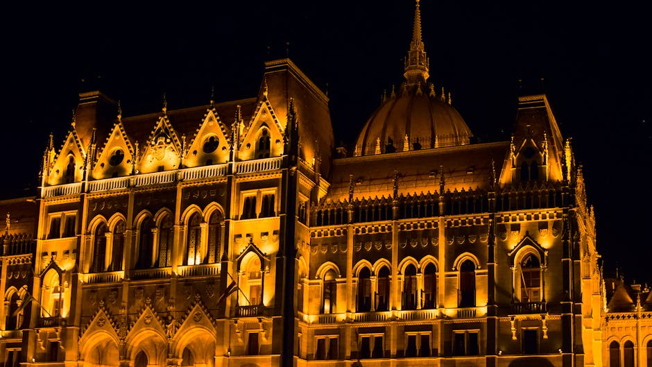 Stunning view of the illuminated Hungarian Parliament Building in Budapest at night.